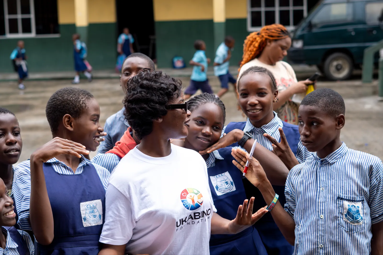 Volunteers and students sharing a joyful moment